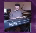 Mike playing his Clavinet E7.  This photo was taken in a photo session for the 